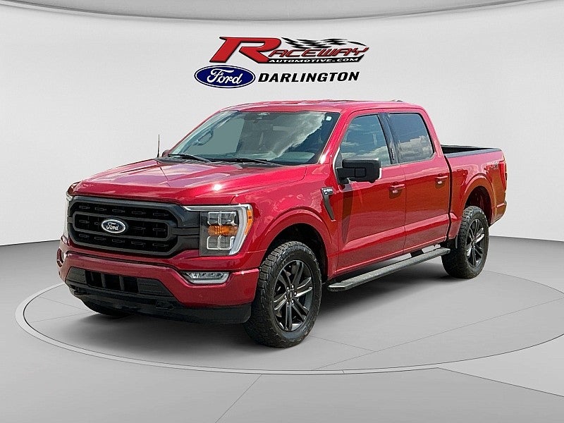 2022 Ford F-150 XLT in Ruby Red — front three-quarter view